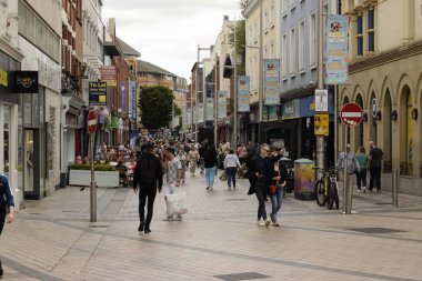 belfast, northern ireland, united kingdom - august 8, 2022 : pedestrians at the city square with ambience of surrounded citylife