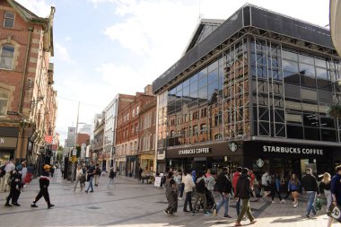 arthur square, belfast, northern ireland, united kingdom - august 8, 2022 : pedestrians and colorful shops at the square
