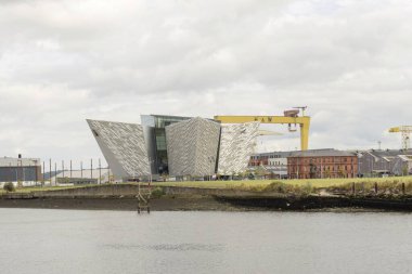 titanic belfast, belfast, northern ireland, united  kingdom - august 8, 2022 : an iconic world leading visitors attraction about rms titanic on lagan river bank