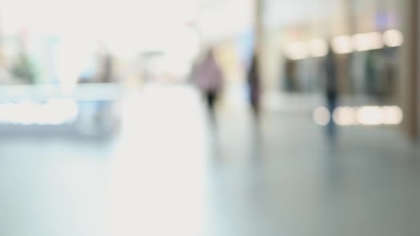 Unrecognizable blurred defocused people shopping mall business bokeh background — Stock Video