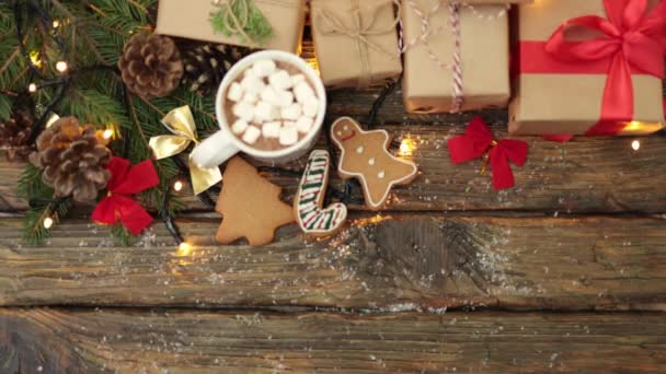 Winter holidays concept: craft gift boxes fir tree, cookies, cup marshmallows — Stock Video
