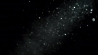 Işık demeti altında yüzen soyut toz parçacıkları. Yavaş çekim. 