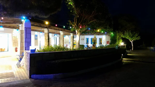 A night view of the cafes and stores in the streets of the Mediterranean village