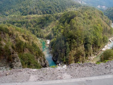 Scenic mountain landscape, view of the mountain river canyon with the forest, green trees, mountains, and blue sky