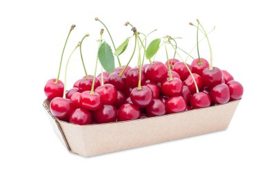 container with ripe, sweet cherries on a white background