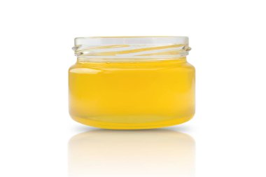 a small jar filled with fresh honey