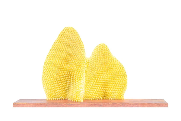 Beeswax isolate on a wooden plank