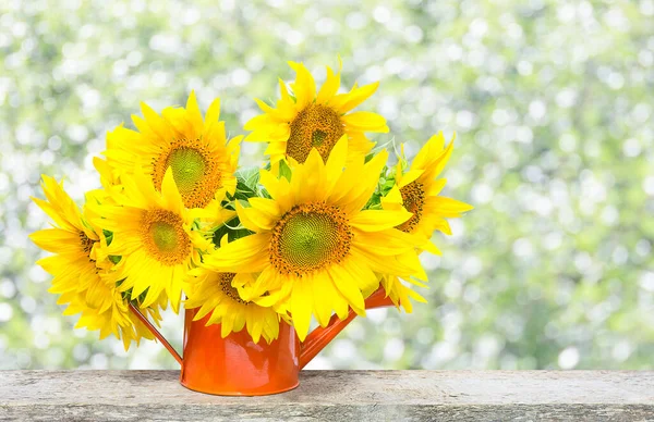 A bouquet of beautiful sunflowers in a vase with copy space