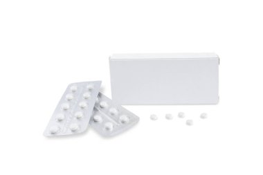 A box with a place for writing and next to it two blisters with tablets and five loose tablets