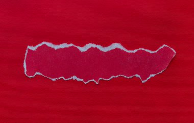 piece of red paper for writing a message, red cardboard background