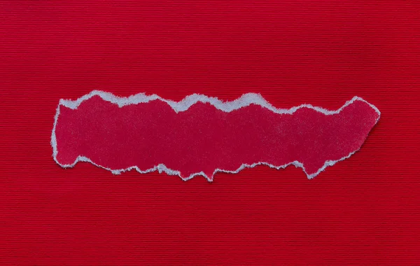 piece of red paper for writing a message, red cardboard background