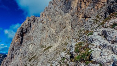 Rocky rocks in the Dolomites. Catinaccio mountain group in Italy. Climbing in the Dolomites. Via ferrata in summer in Italy.
