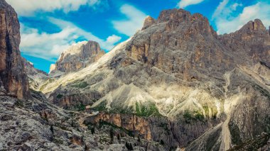 Rocky mountains in the Dolomites. Catinaccio mountain group in Italy. Via ferrata in summer in Italy. Green valley in the Italian mountains. Beautiful panorama in the mountains