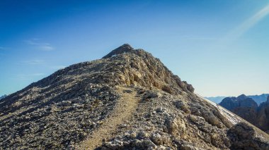 Mount Catinaccio d'Antermoia. Mountains in the Dolomites. Climbing on via ferratas. Mountain panorama in Italy. Snow in the mountains. Rocky mountains in the Dolomites.