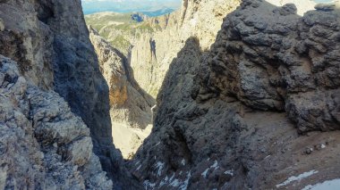 Mount Catinaccio d'Antermoia. Mountains in the Dolomites. Snow in the rocky mountains. Via ferrata in the Dolomites. Mountain trips.