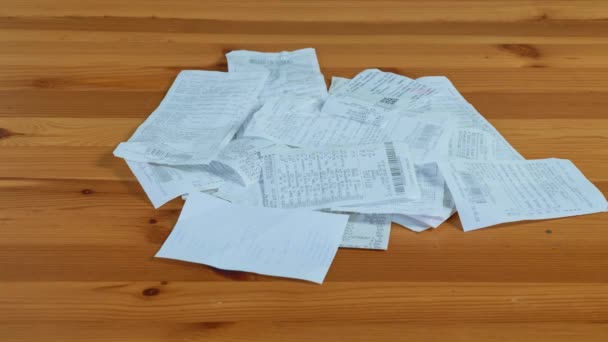 Paper Receipt Pile Shopping Receipts Wooden Table Stop Motion — Wideo stockowe