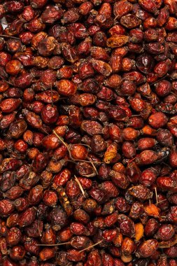 Dried rose hips healthy nutrition closeup top view background