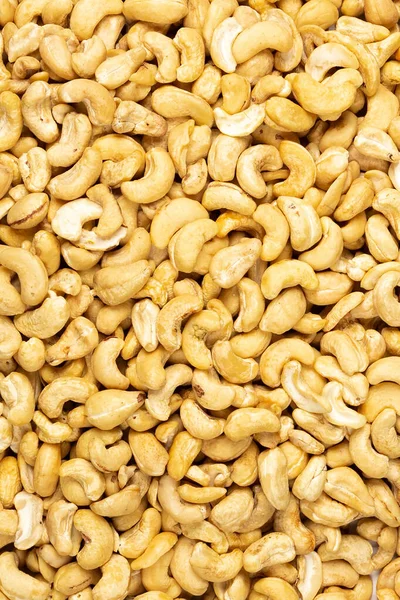 Peeled Fresh Golden Cashew Nuts Bulk Top View Background — Fotografie, imagine de stoc