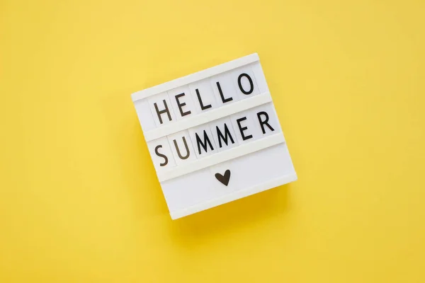 Lightbox with text Hello Summer. Summer vacation concept. Top view. Copy space.