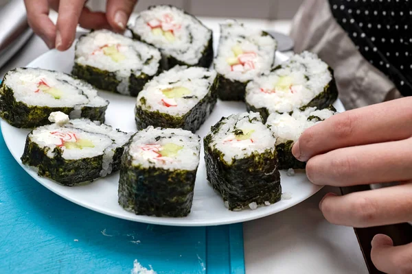 White Plate Girl Smoothes Homemade Sushi — Stock Photo, Image