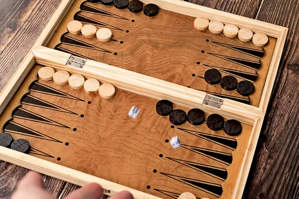 Man Threw Dice Wooden Board Which Backgammon Chips Located — Stok Foto