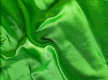 Dalgalı yeşil ipek ya da saten kumaş. Lüks kumaş, pürüzsüz ve zarif.