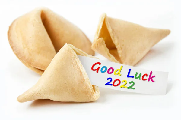 Fortune cookies and label Good Luck 2022 on white background closeup