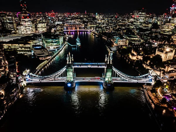 London Tower Bridge at Night with urban architectures Aerial drone view. One of Londons most famous bridges and must-see landmarks in United Kingdom — Stockfoto