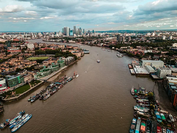 Aerial view of Bank and Canary Wharf, central Londons leading financial districts with famous skyscrapers at golden hour sunset with river Thames in foreground — Stock Photo, Image