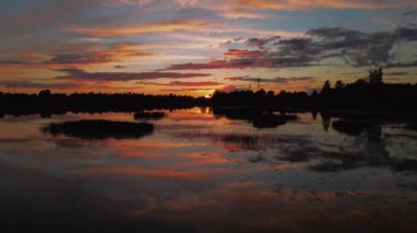 Sunset sky reflect in water over river landscape, nature background. Aerial drone view