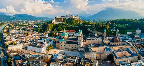 Beautiful aerial drone panorama of Salzburg city in Austria. View of the historic city of Salzburg and Salzach river at summer.