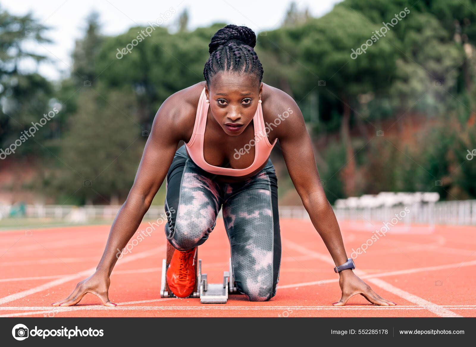 Athlete sprinter in starting position Stock Photo by ©santypan 552285178
