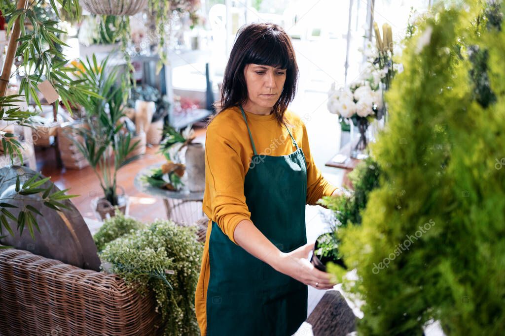 Beautiful Florist Woman Working with Plants