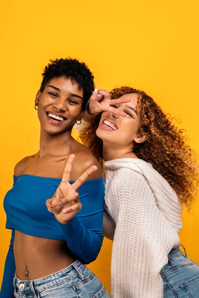 Stock Photo Cheerful Afro Women Having Fun Studio Shot Yellow — 스톡 사진