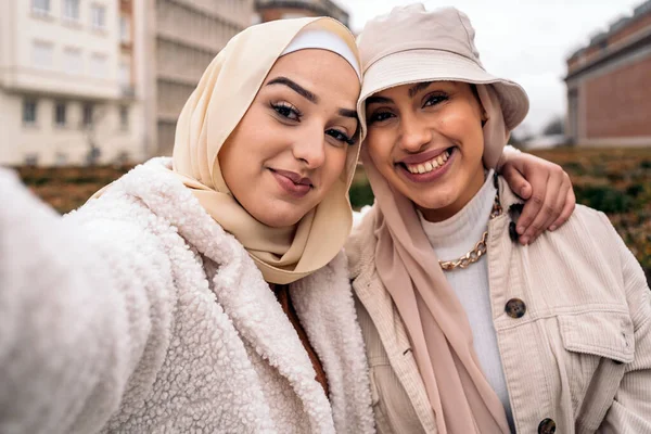 Cheerful Girls Wearing Hijab Having Fun Taking Selfie Street — ストック写真