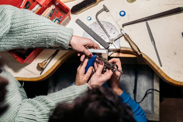 Unrecognized Women Using Tools Jewelry Workshop — стоковое фото