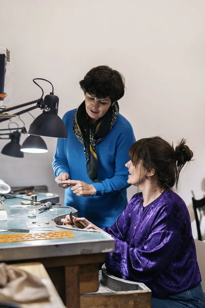 Concentrated Adult Women Working Jewelry Workshop — стоковое фото