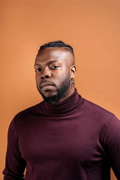 Black Man Expressive Eyes Looking Camera Studio Shot Brown Background — Foto Stock