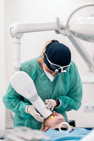 Adult Woman Lying Dental Chair Receiving Dental Treatment Dentist Wearing — стоковое фото