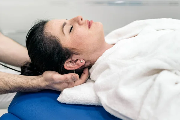 Relaxed Woman Enjoying Neck Massage While Lying Stretcher Physiotherapy Clinic — Foto de Stock