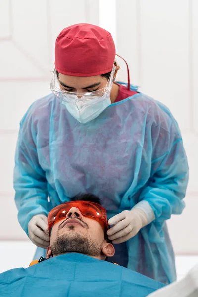 Man Lying Dental Chair Wearing Protective Glasses Ready Use Tooth — Stock Photo, Image