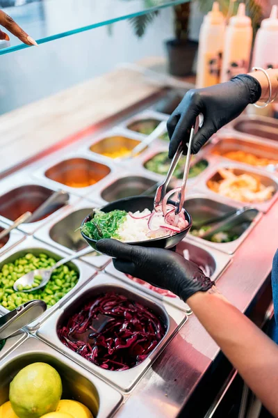 Unrecognized Restaurant Worker Protective Gloves Putting Ingredients Poke Bowl Rice — Stock Photo, Image