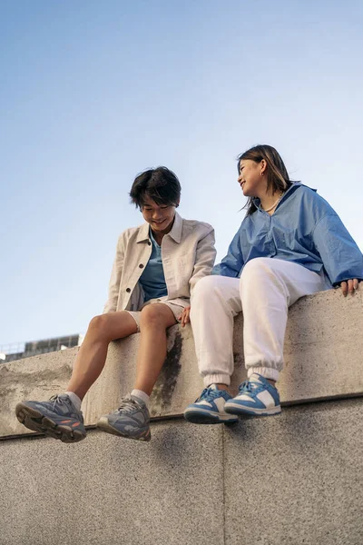 Cool Young Asian Couple Sitting City Having Fun Looking Each — Stock Photo, Image