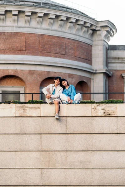 Cool Young Asian Couple Sitting City Posing Looking Camera — Stock Photo, Image