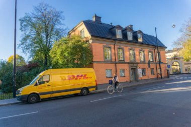 Stockholm, Sweden - October 19, 2021: Delivery van in the middle of Stockholm, parked for delivery in front of the building