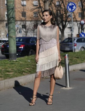 Fashion blogger Karina posing for photographers before Fendi fashion show during Milano fashion week woman fall/winter collections