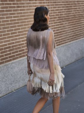 Fashion blogger Karina Nigai walking in the street before Fendi fashion show during Milano fashion week woman fall/winter collections
