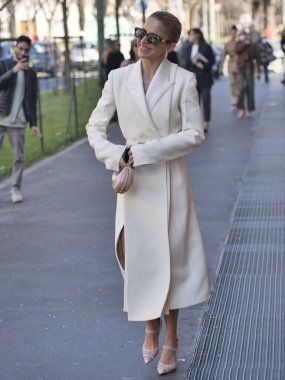 Fashion blogger Caroline Daur walking in the street before Fendi fashion show during Milano fashion week woman fall/winter collections