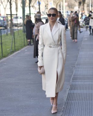 Fashion blogger Caroline Daur walking in the street before Fendi fashion show during Milano fashion week woman fall/winter collections