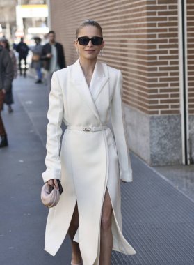 Fashion blogger Caroline Daur walking in the street before Fendi fashion show during Milano fashion week woman fall/winter collections